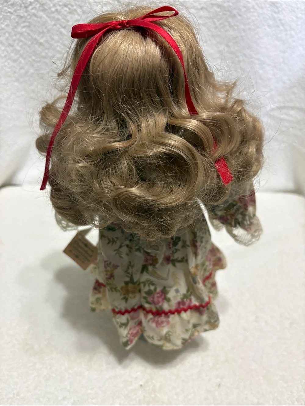 Porcelain Blonde Curly-Hair Doll in Floral Cream Dress with Pink Trim